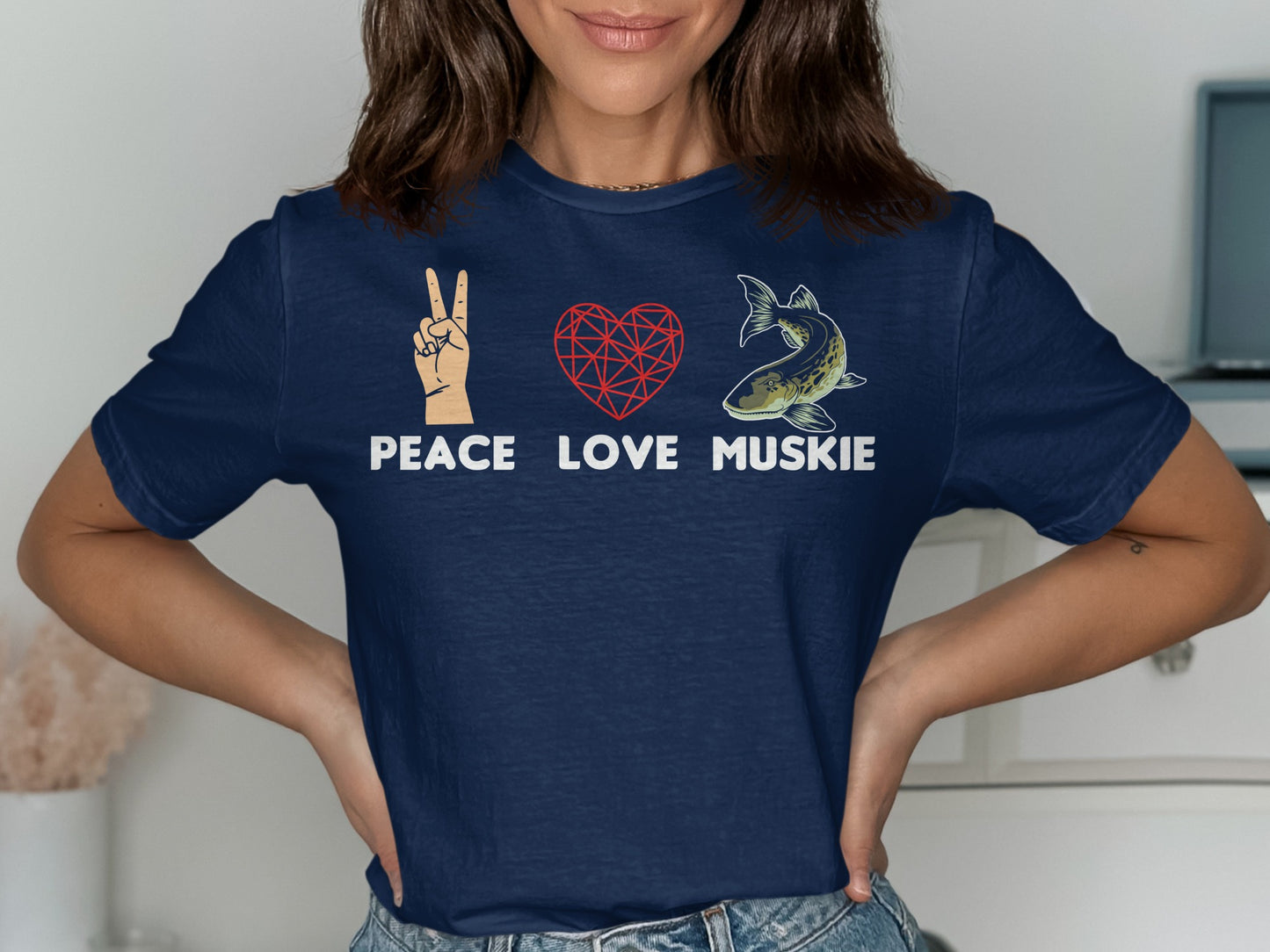 Navy t-shirt with peace sign, heart, and muskie graphic.