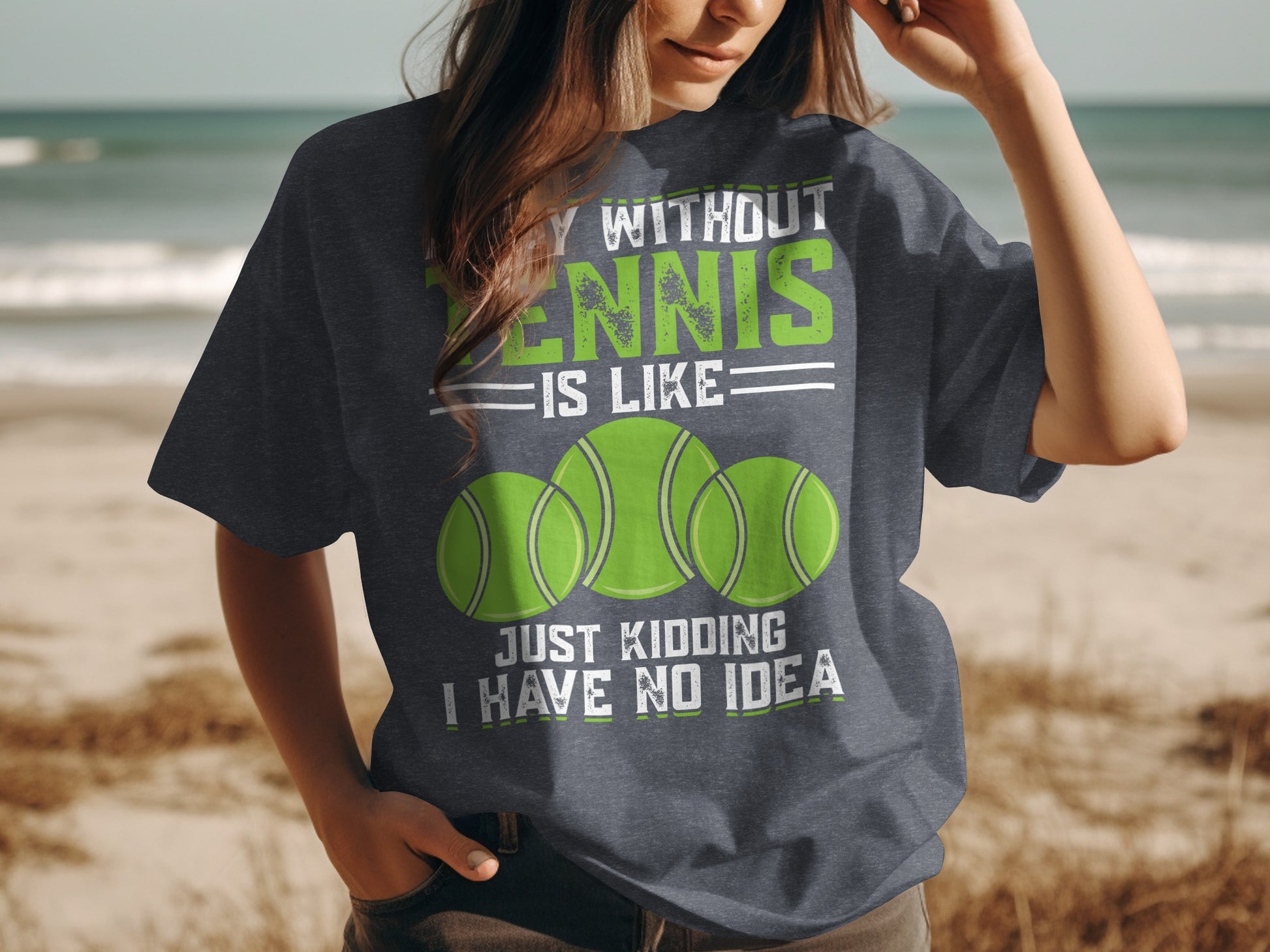 T-shirt with "Tennis is like just kidding I have no idea" and three tennis balls.