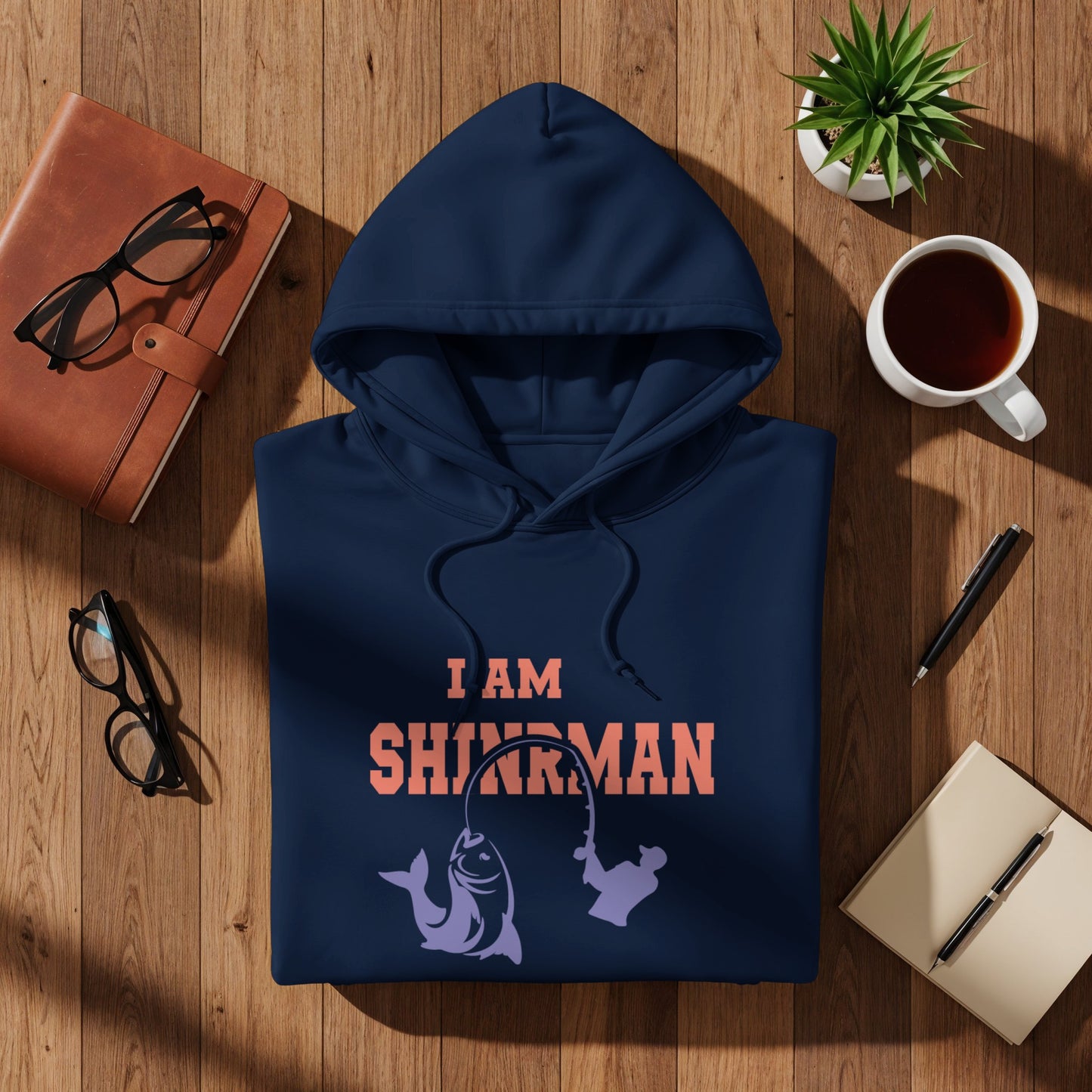 Navy hoodie with "I AM SHIRMAN" text and fish graphic.