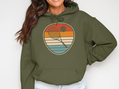 Olive green hoodie with vintage tennis racket and ball emblem.