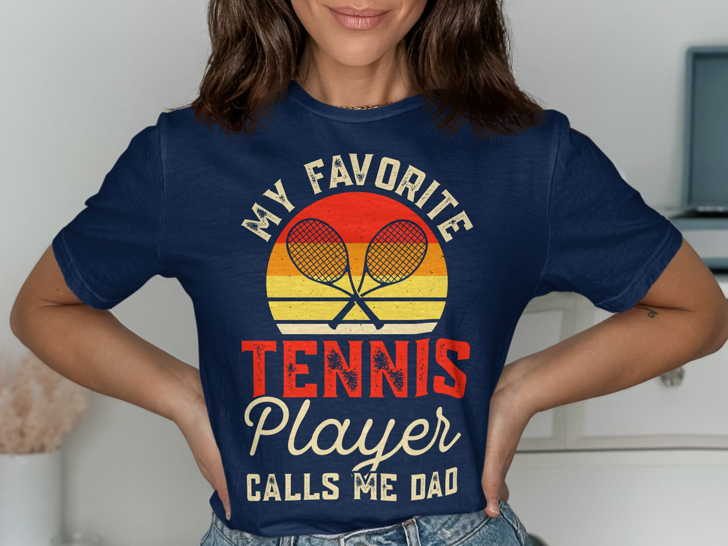Navy t-shirt with "My Favorite Player Calls Me Dad" and crossed tennis rackets graphic.