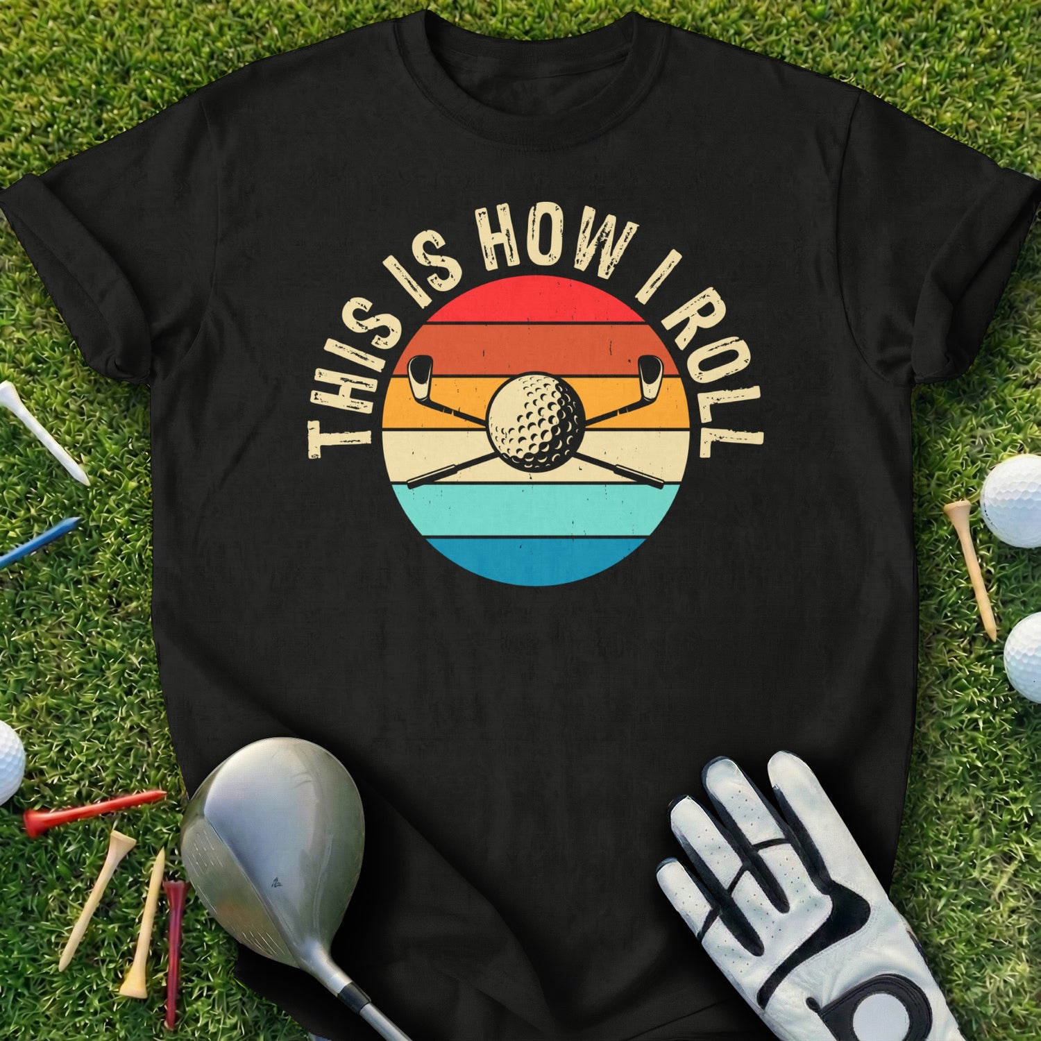 T-shirt with "This is How I Roll" text and golf clubs over a golf ball.
