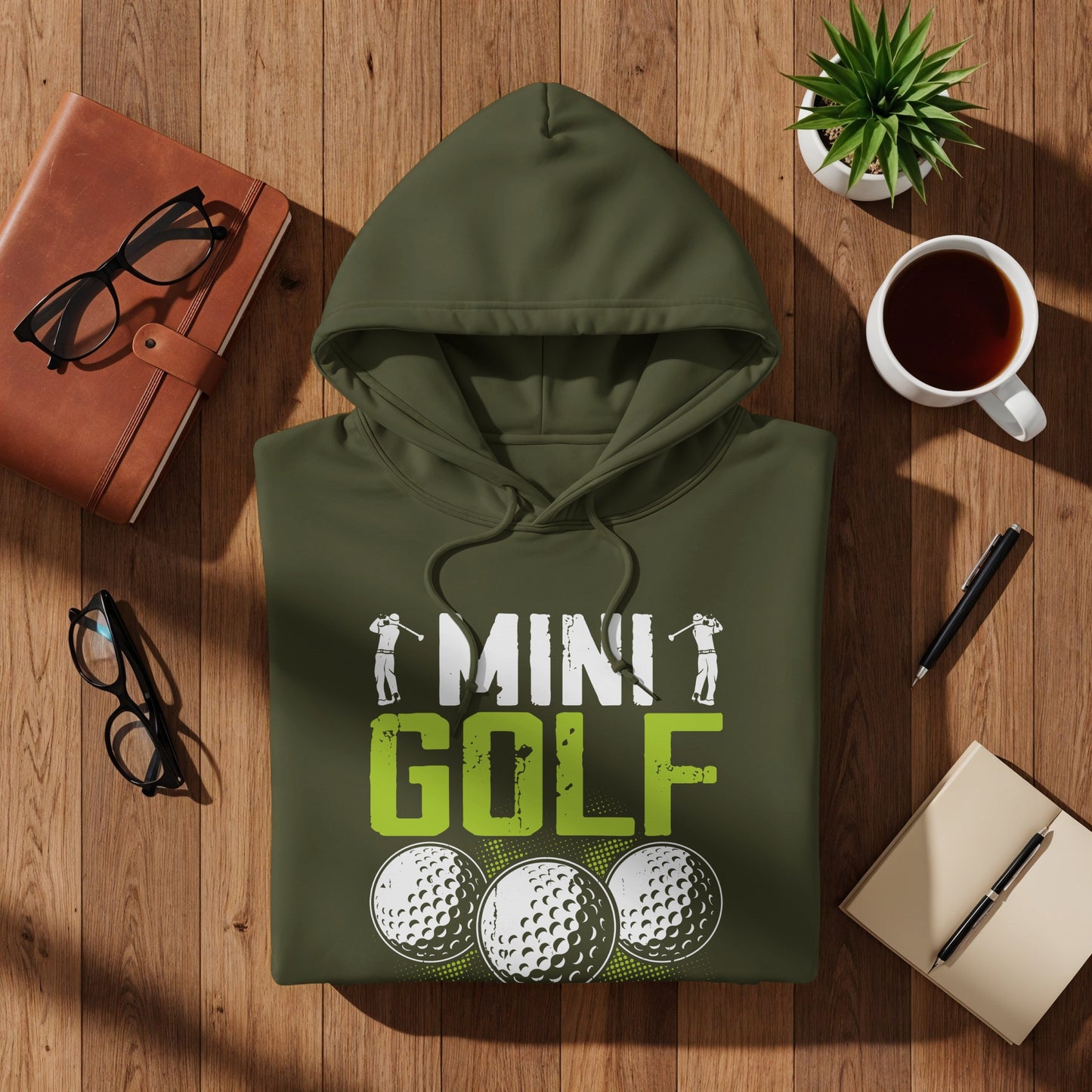 Olive green hoodie with "Mini Golf" text and golf ball graphics.