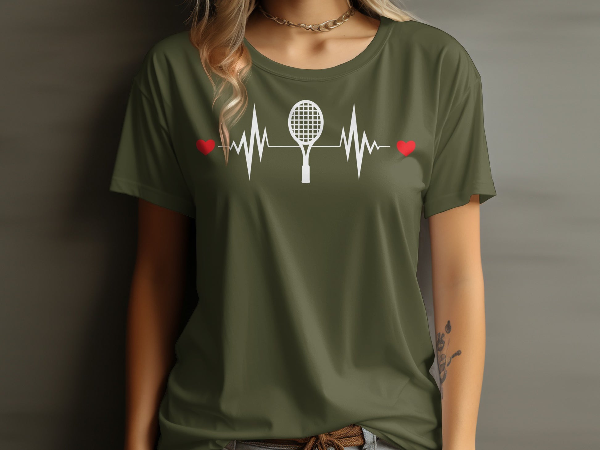 Green t-shirt with white tennis racket and heart rate design.