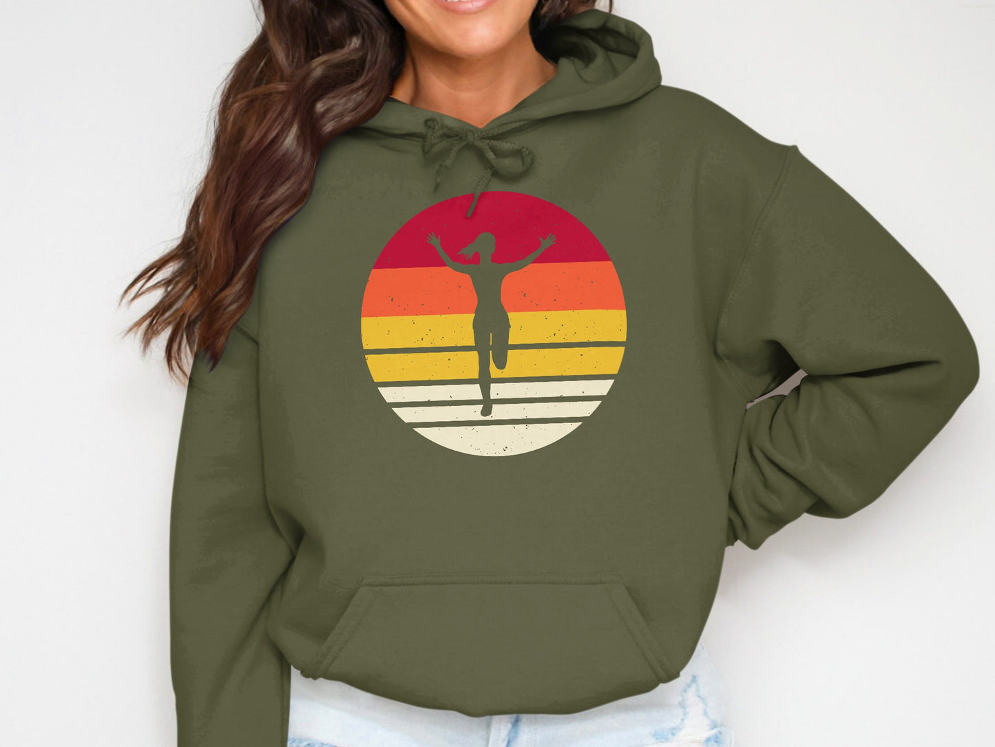 Olive green hoodie with a runner silhouette within a colorful sunset circle logo.