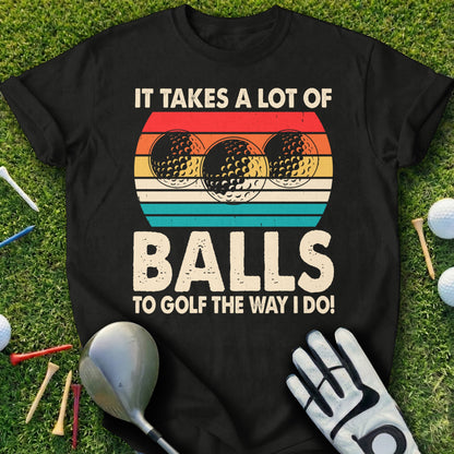Black t-shirt with "IT TAKES A LOT OF BALLS TO GOLF THE WAY I DO!" and golf balls graphic.