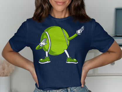 Cartoon tennis ball character with arms and legs dabbing on a navy t-shirt.