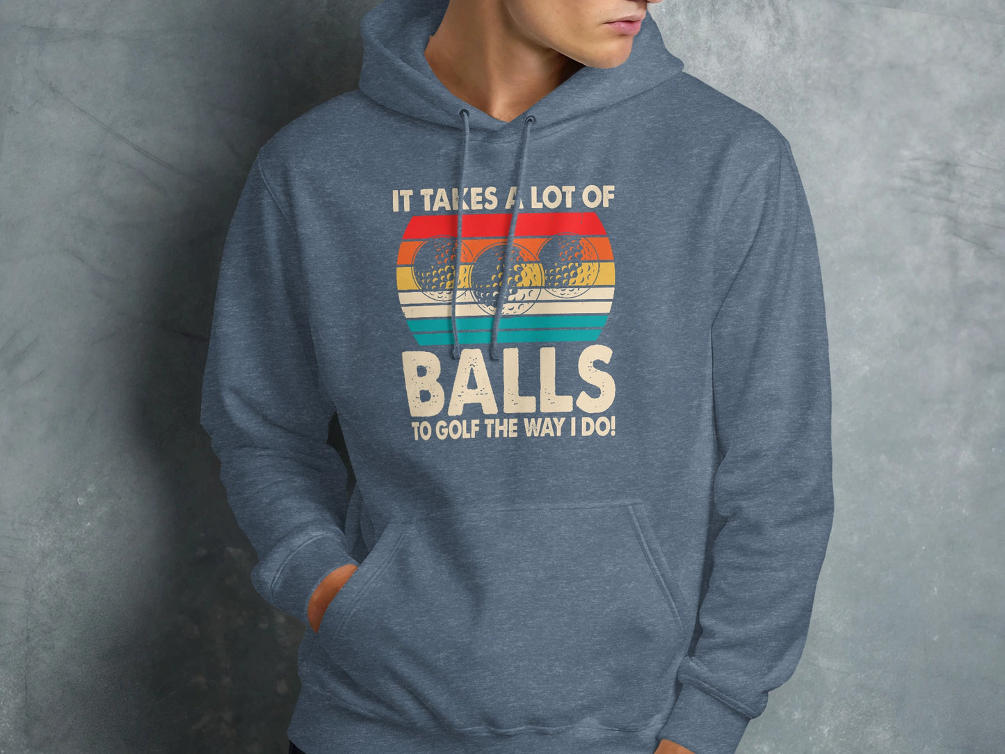 Blue hoodie with text "It takes a lot of balls to golf the way I do" and golf balls.