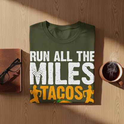 Green t-shirt with text "RUN ALL THE MILES TACOS" and running figures.