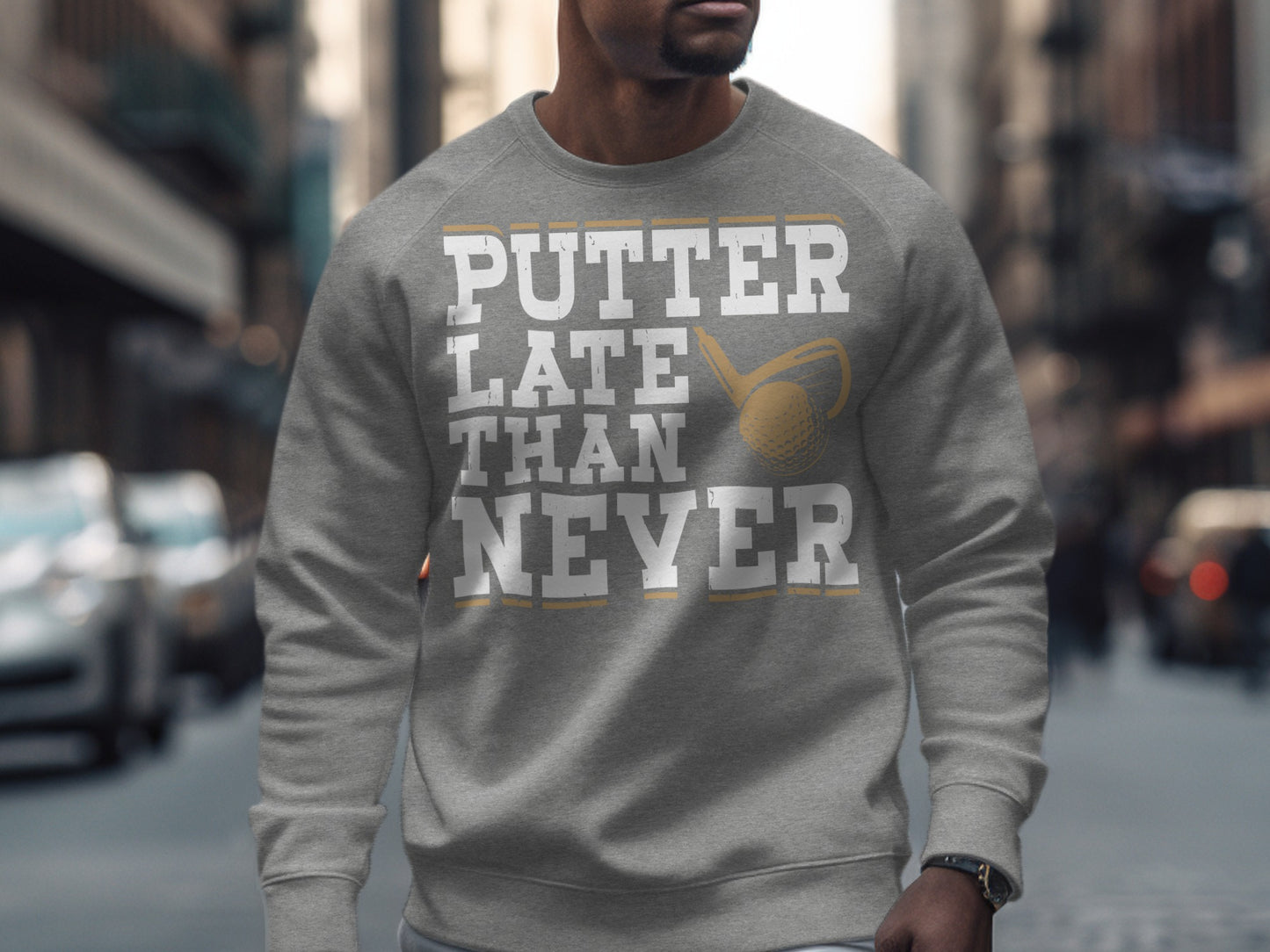 Grey sweatshirt with "Putter Late Than Never" and a golf ball and club graphic.