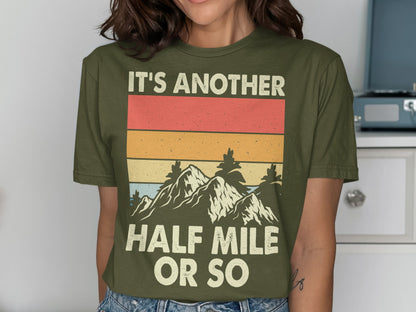 Olive green t-shirt with mountains and "It's Another Half Mile Or So" text.