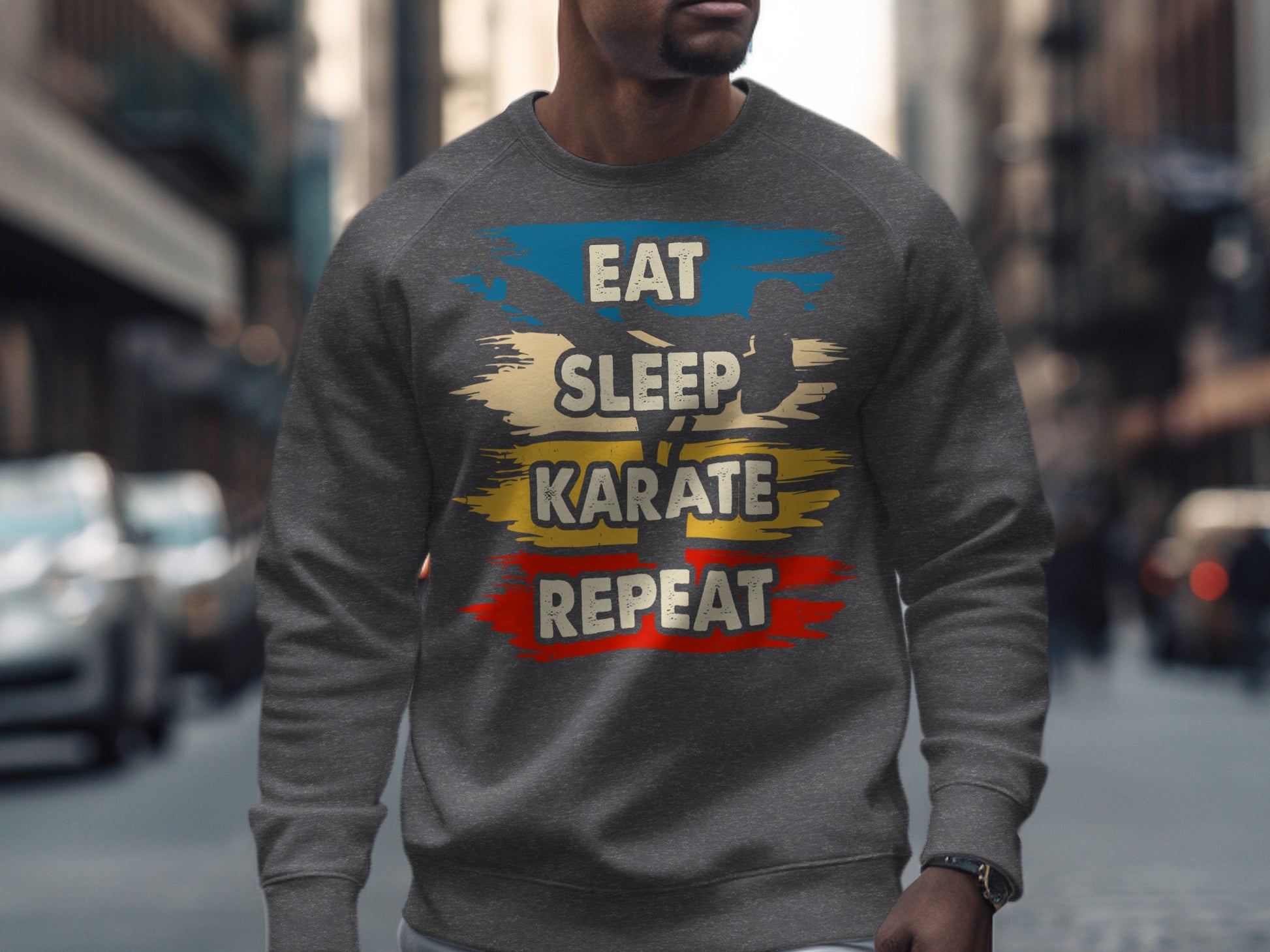 Grey sweatshirt with "Eat Sleep Karate Repeat" graphic in blue, yellow, and red.