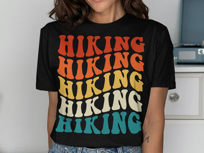 T-shirt with stacked "HIKING" text in retro colors: red, orange, yellow, and blue.