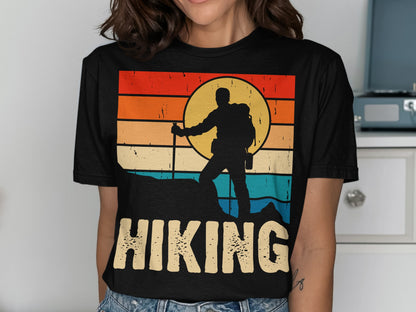 Retro sunset graphic of hiker on a mountain peak with "HIKING" text.
