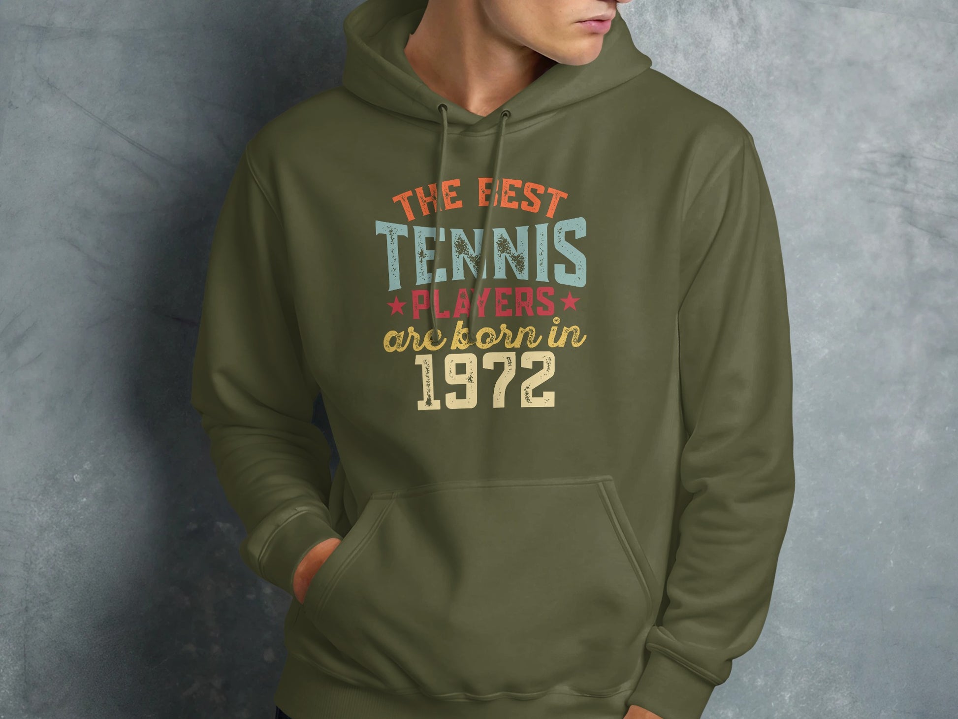 Green hoodie with "The best tennis players are born in 1972" text.