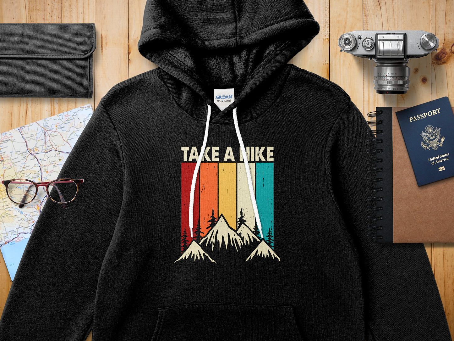 Black hooded sweatshirt with vintage mountain graphic and "TAKE A HIKE" text.