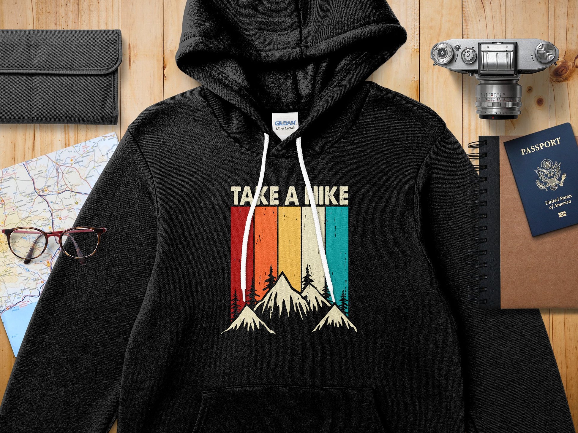 Black hooded sweatshirt with vintage mountain graphic and "TAKE A HIKE" text.