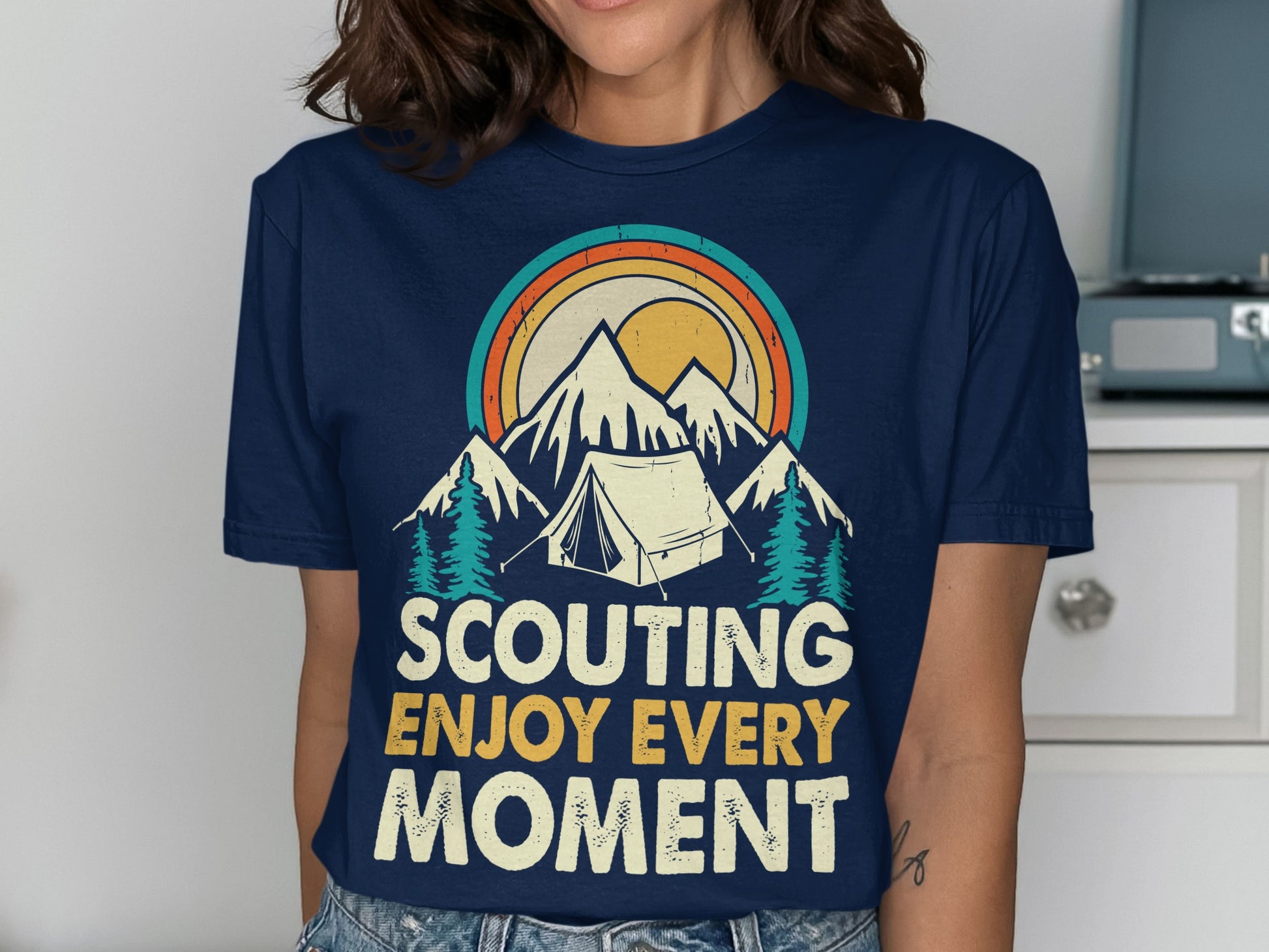 Navy t-shirt with vintage mountain, tent, and sun graphic and text.