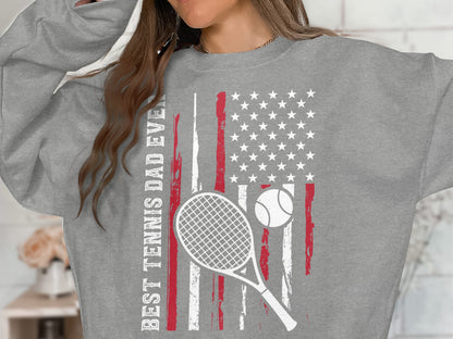 Gray sweatshirt with "BEST TENNIS DAD EVER" text and American flag tennis graphic.
