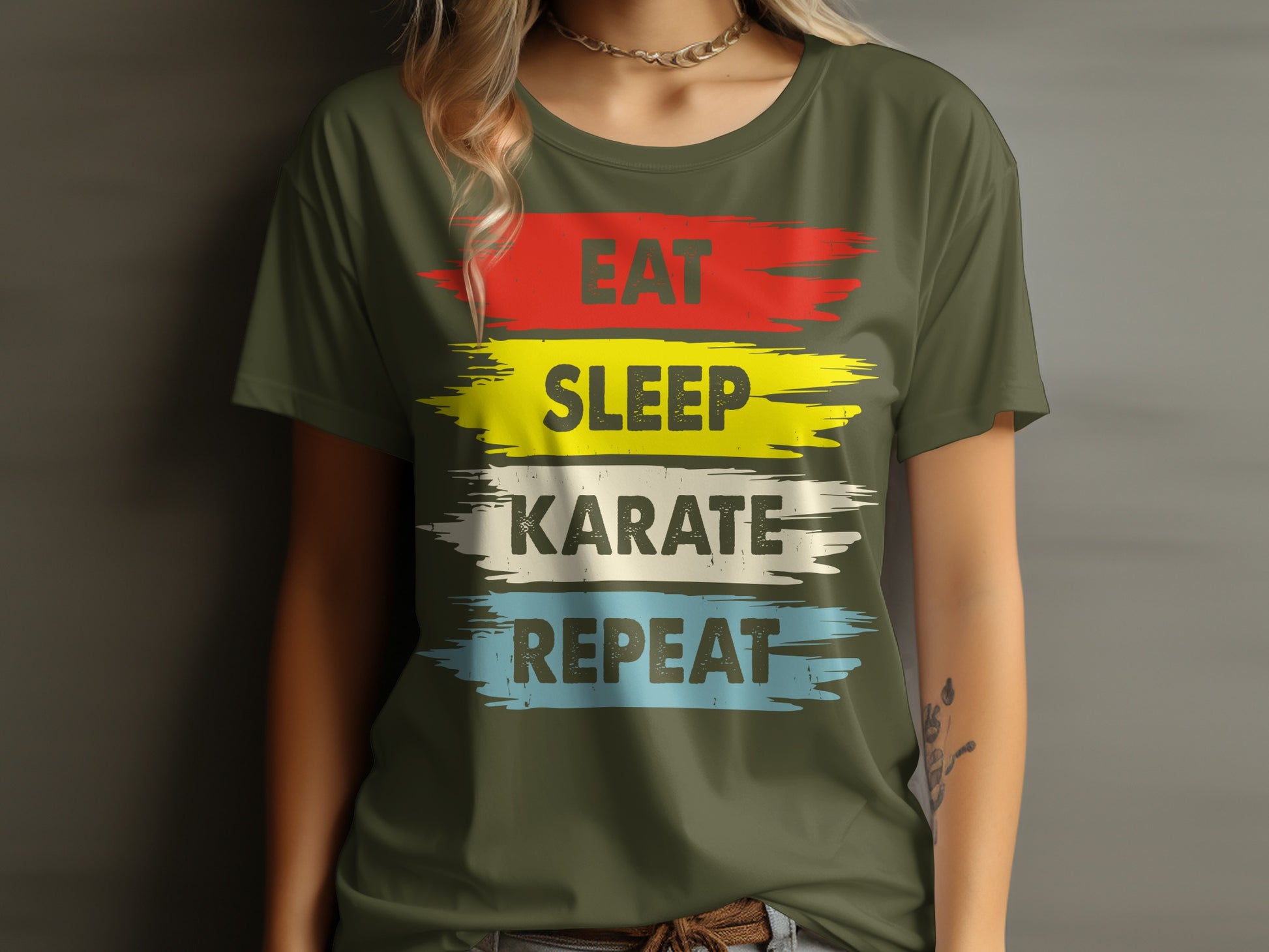 Olive green t-shirt with "EAT SLEEP KARATE REPEAT" in colorful brushstrokes.