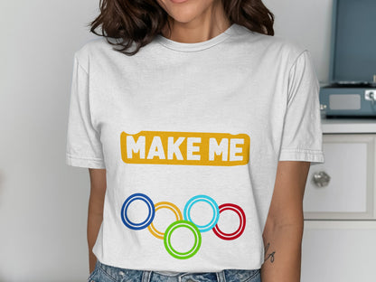 White t-shirt with "MAKE ME" and Olympic rings logo.
