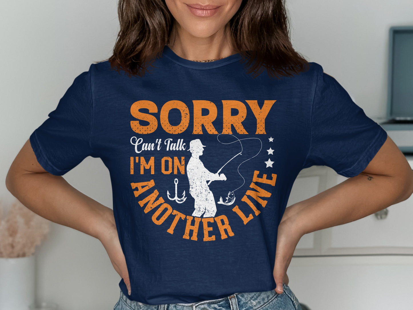 Navy t-shirt with orange text "Sorry, can't talk, I'm on another line".