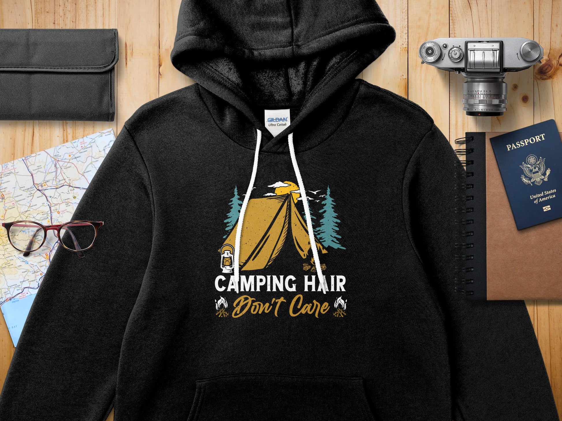 Black Gildan hoodie with "Camping Hair Don't Care" graphic and tent scene.