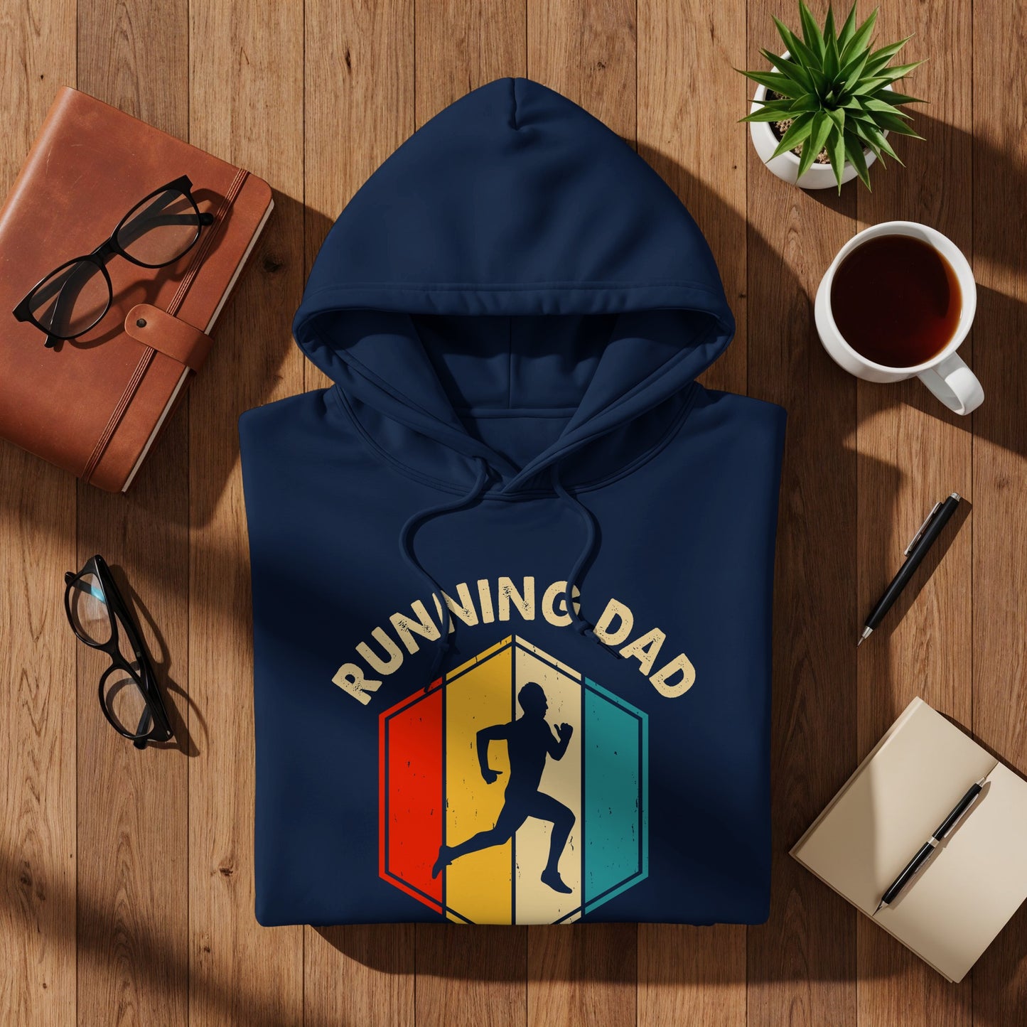 Navy hoodie with "Running Dad" text and runner graphic on colorful hexagon.