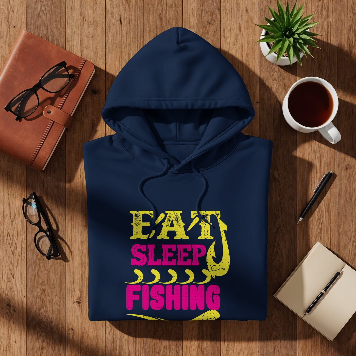 Navy blue hoodie with "Eat Sleep Fishing" text in pink and yellow.