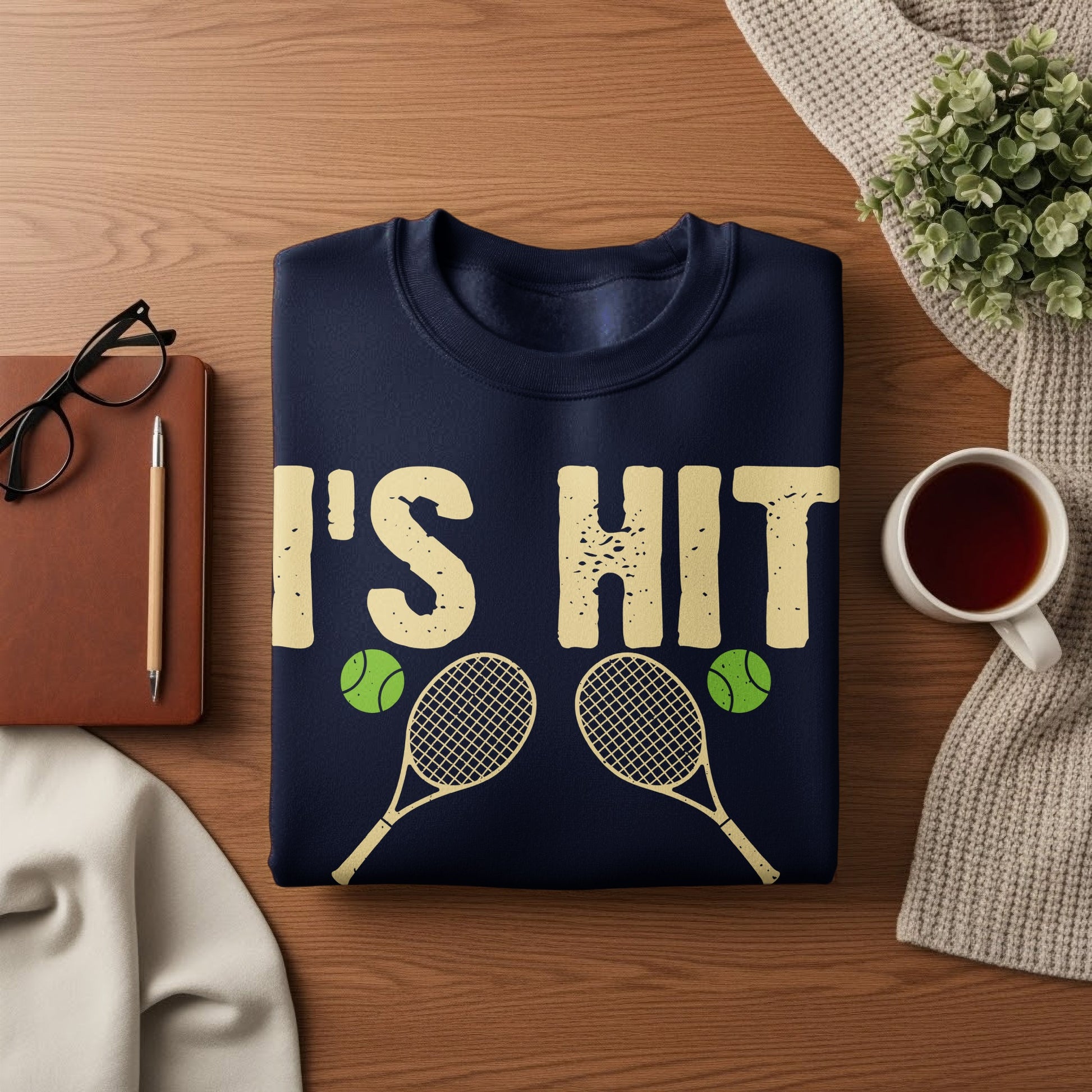 Navy sweatshirt with "I'S HIT" and tennis rackets graphic.