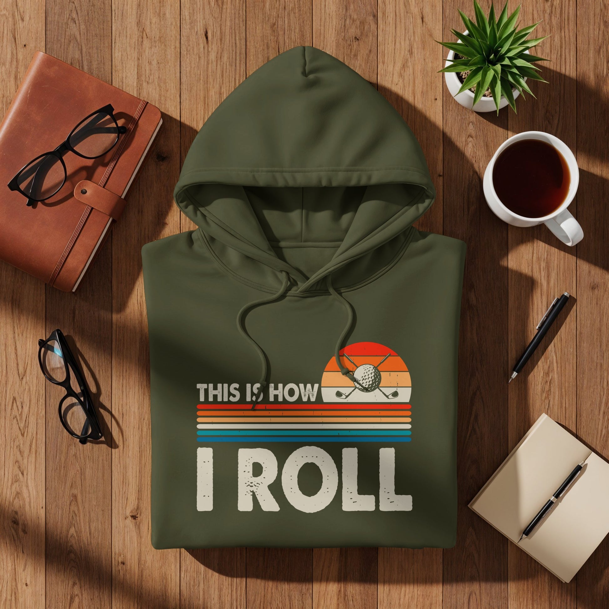 Olive green hoodie with "THIS IS HOW I ROLL" and golf graphic.