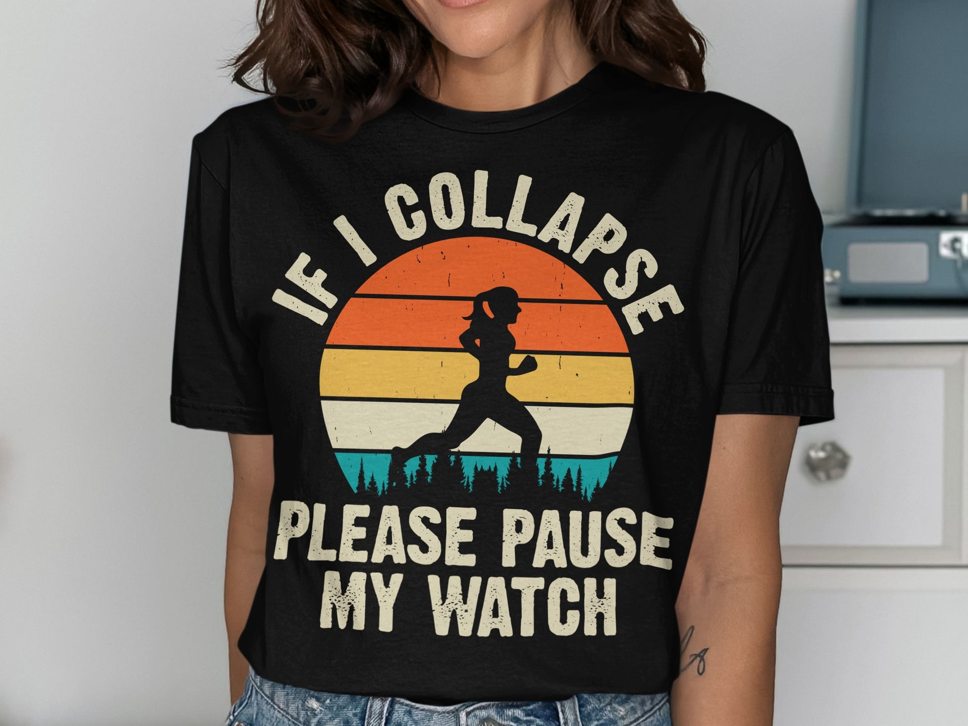 T-shirt with runner graphic and text "IF I COLLAPSE PLEASE PAUSE MY WATCH".