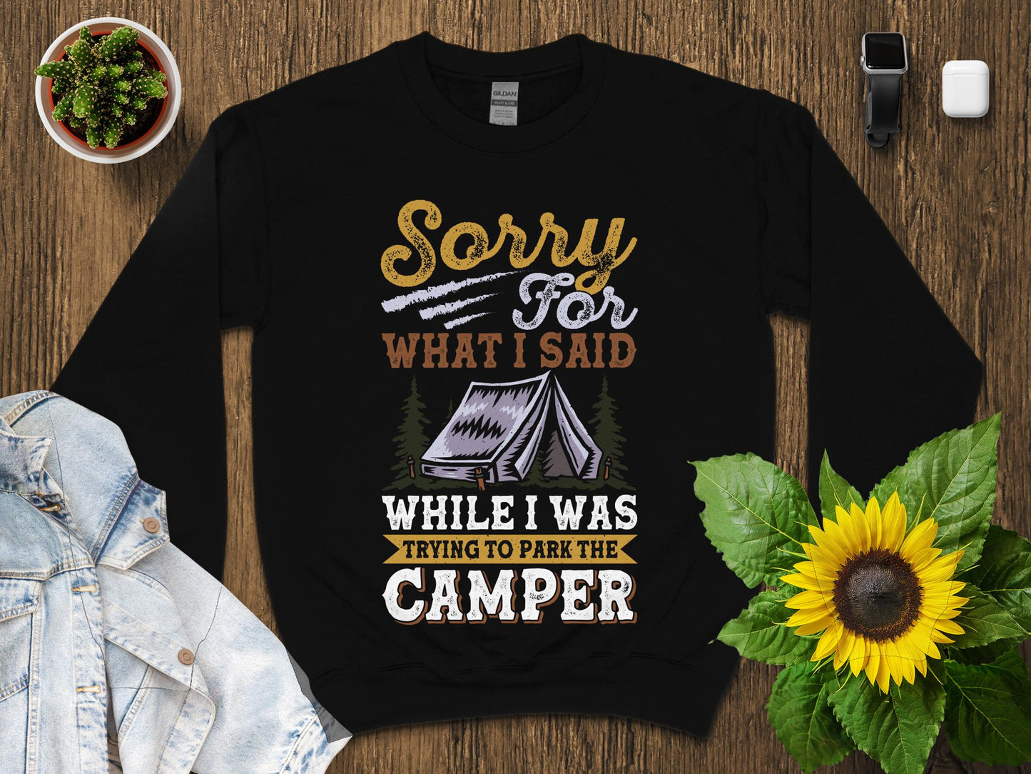 Black sweatshirt with "Sorry For What I Said While I Was Trying to Park the Camper" text and tent graphic.