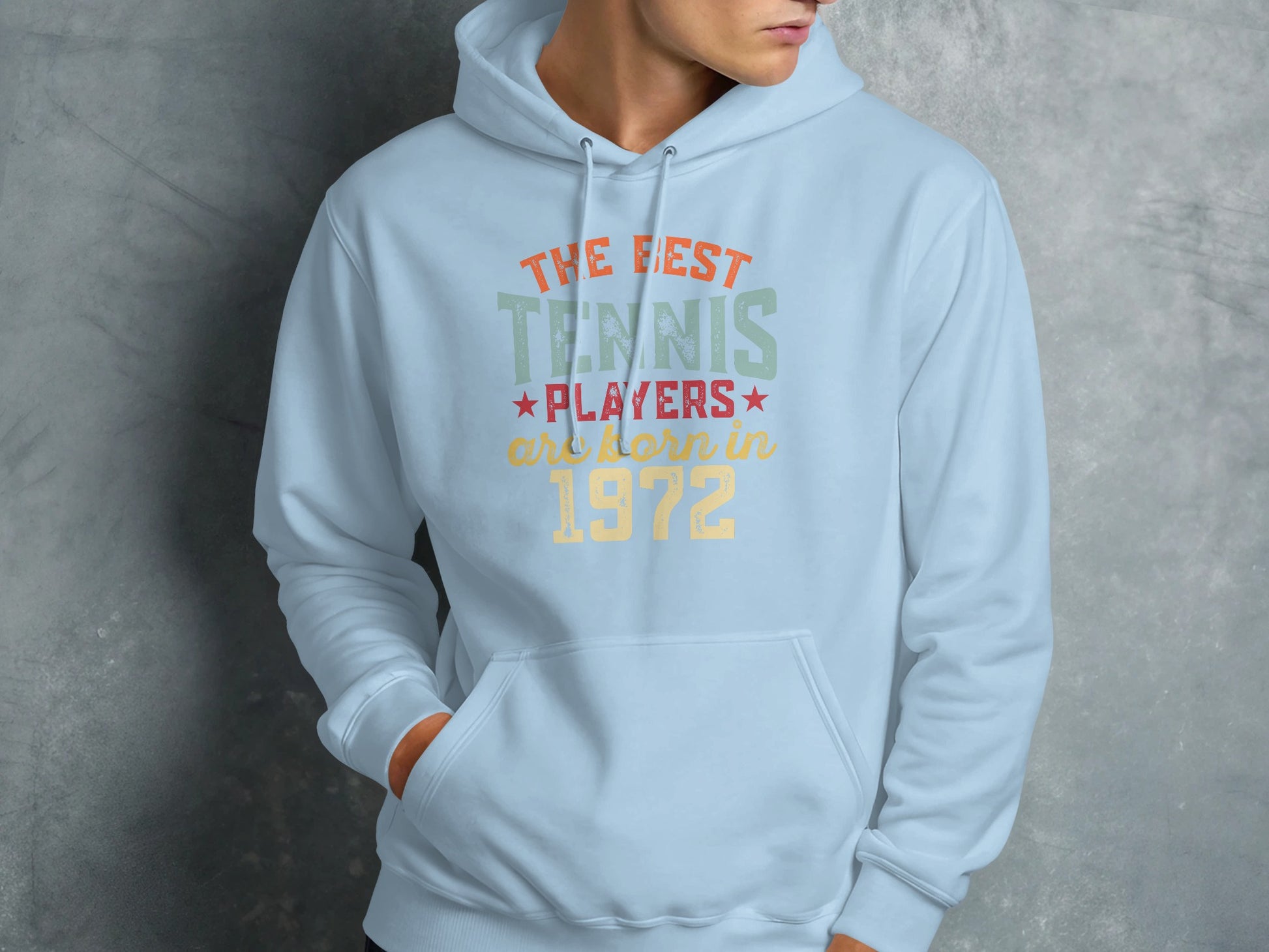 Light blue hoodie with "The best tennis players are born in 1972" text.
