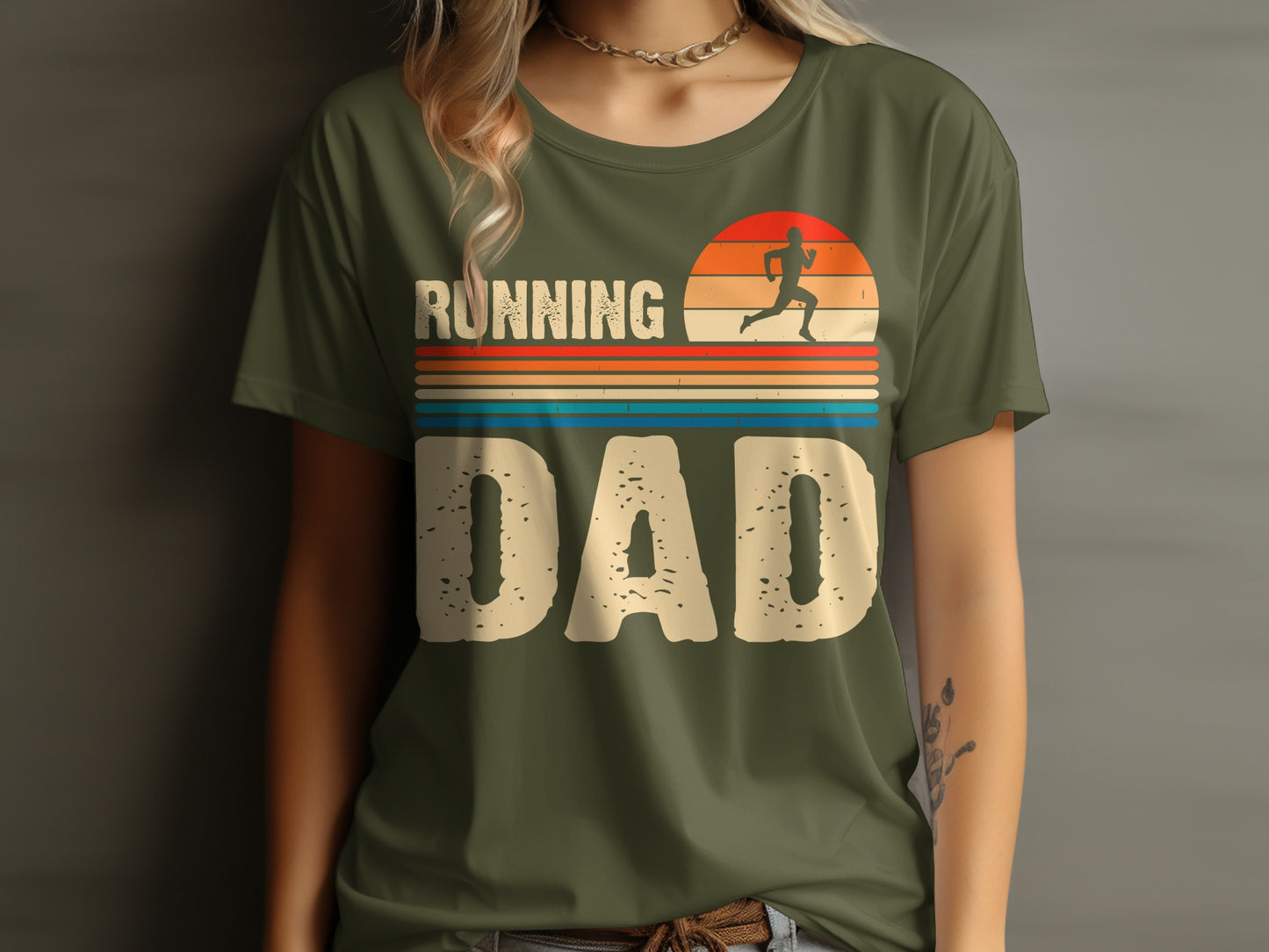 Running Dad text and runner silhouette with retro sunset design on a green t-shirt.