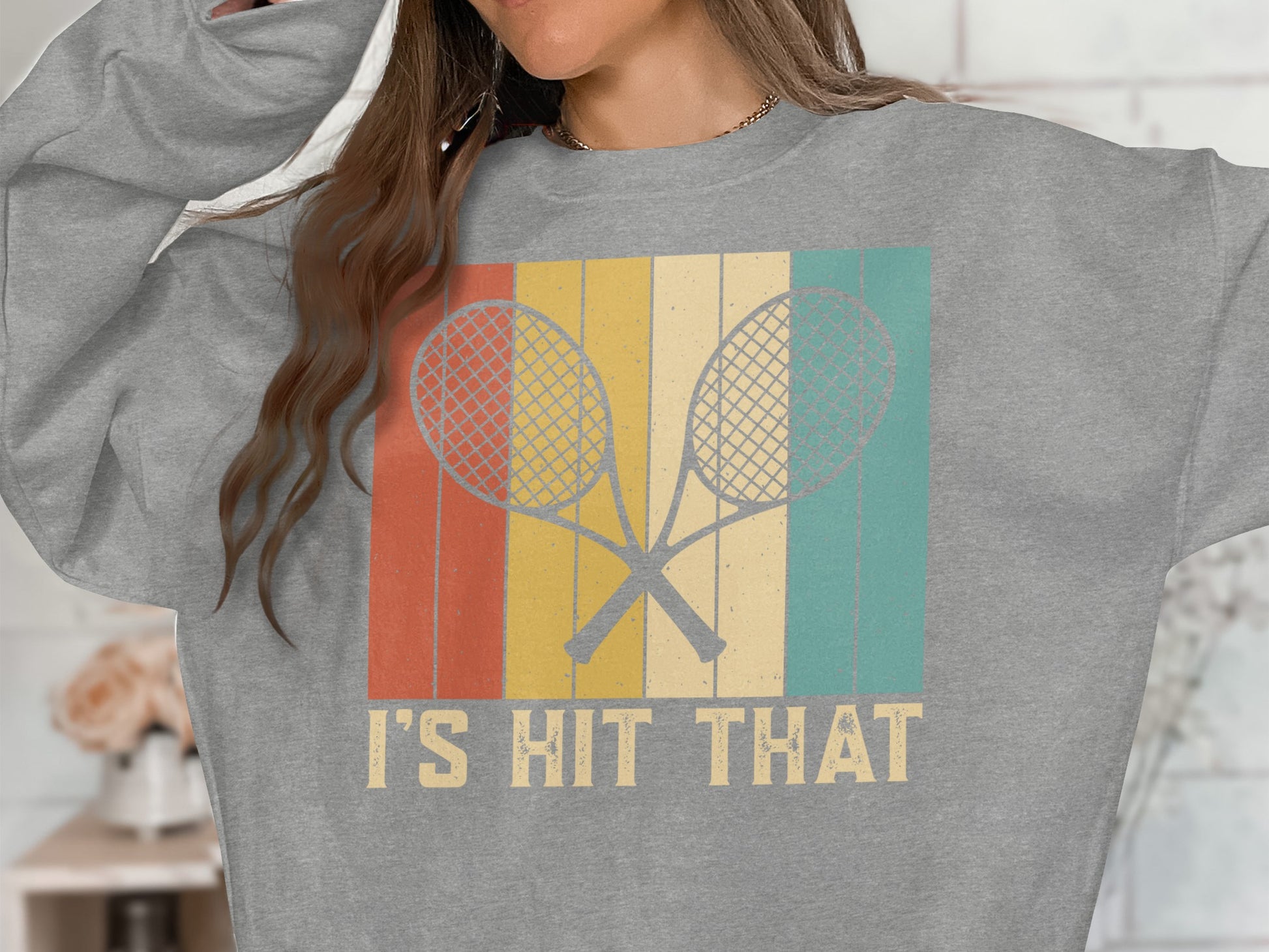 Gray sweatshirt with crossed tennis rackets and "I'S HIT THAT" text.