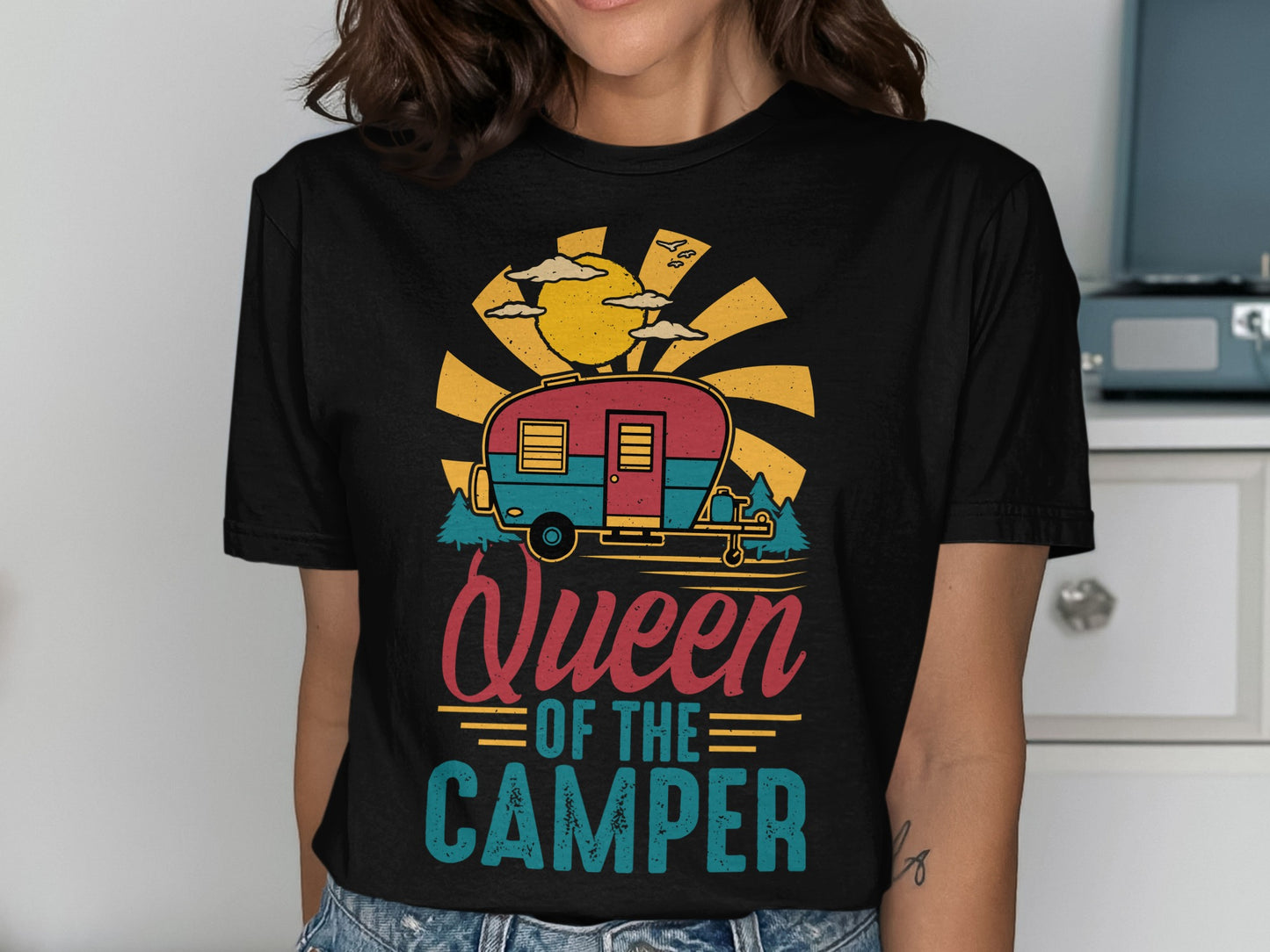 T-shirt with vintage camper, sun, trees, and "Queen of the Camper" text.