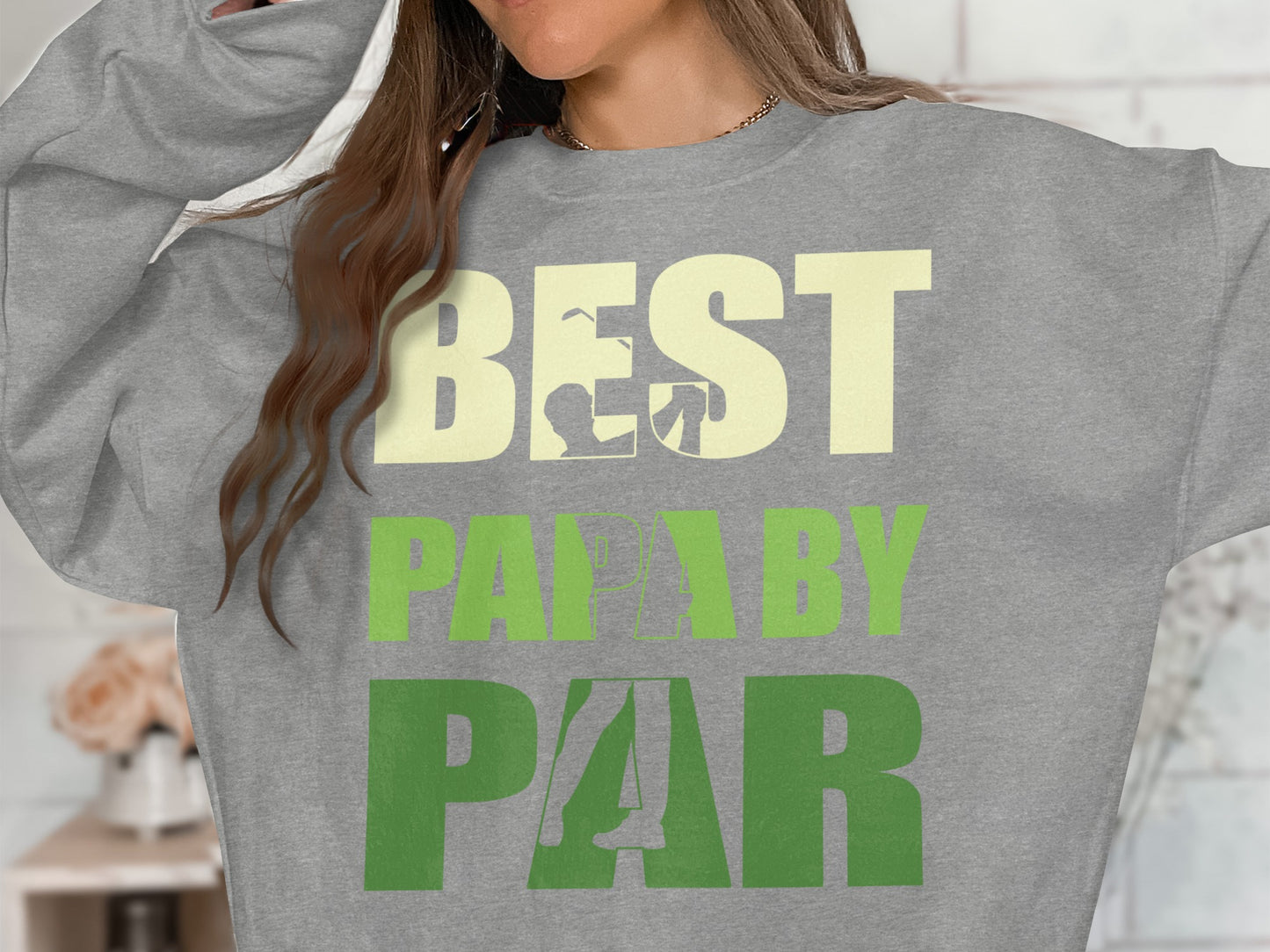 Grey sweatshirt with "BEST DAD BY PAR" text in cream and green.